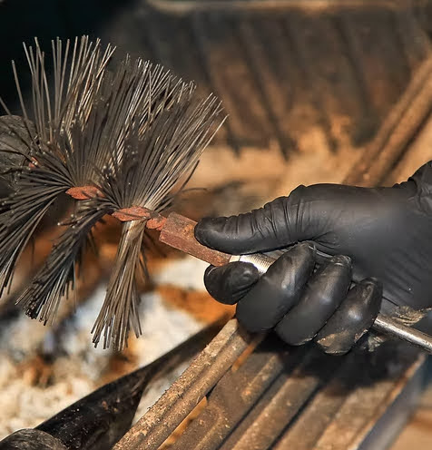Close-up of chimney sweep brush